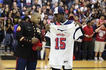 Cypress Ridge senior wide receiver Keham Siverand is presented with the Marine Corps Semper Fidelis All-American Bowl jersey during the Rams’ pep rally on Oct. 17.