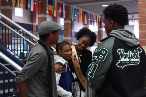 Freshman Paris LaGrone thanks the performers for coming to her school. 