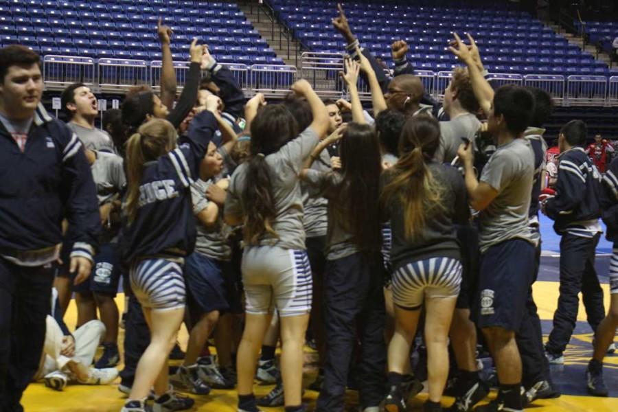 Cypress Ridge wrestling teams gets pumped before the UIL 6A District 10 championships hosted at the Berry Center.