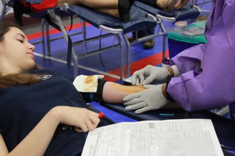 Junior Sara Toner gets her blood drawn for the first time.