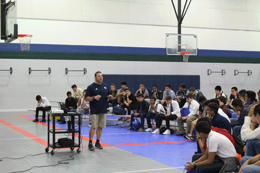 Wrestling coach Tim Ray lectures the Freshmen boys on hygiene, proper attire, and etiquette.