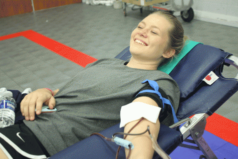 Senior Maegan Valencia gives blood with a smile. “I hope I can make a difference with my donation.” says Valencia.