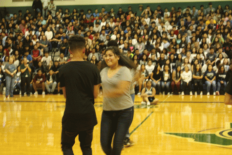 Brandon Lopez makes his partner Dulce Frias laugh as he gives her a spin