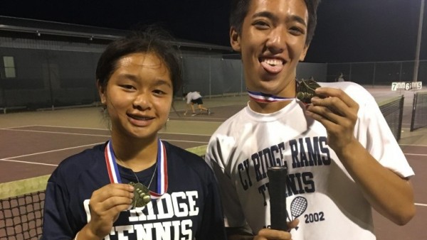 Players Michael Pham and Brittney Tran show off their gold medal after the tournament. Photo by: Terry Stanley