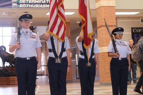 The color guard presents the flags at the Multicultural Event for Black History Month. 