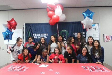 Rachel Garant signs to University of Houston while surrounded by her teammates,friends, and family that showed their support.