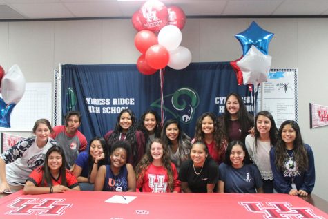 Rachel Garant signs to University of Houston while surrounded by her teammates,friends, and family that showed their support.